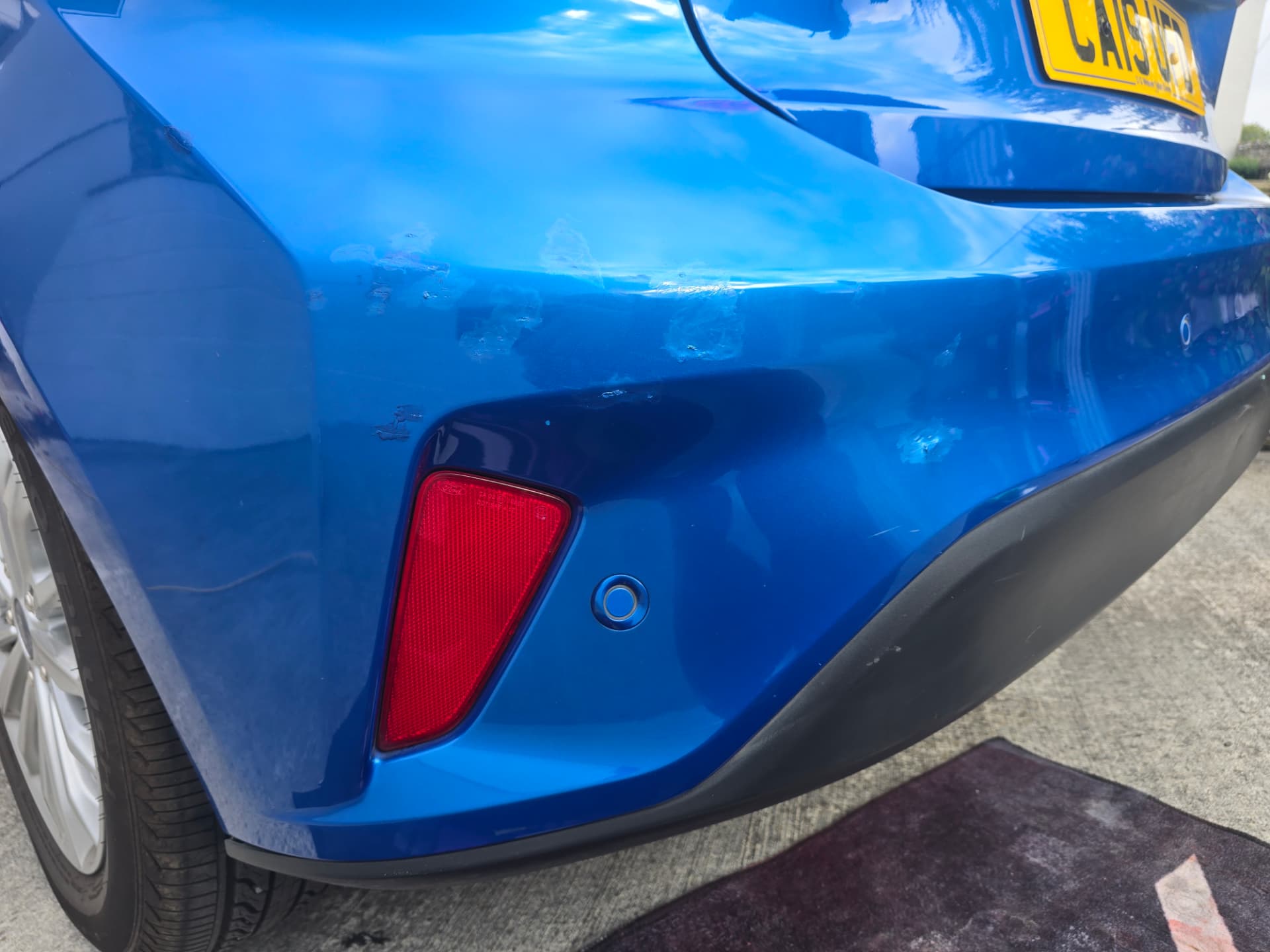 Ford Focus (blue), Bumper scuff repair, South Wales — before the SMART repair