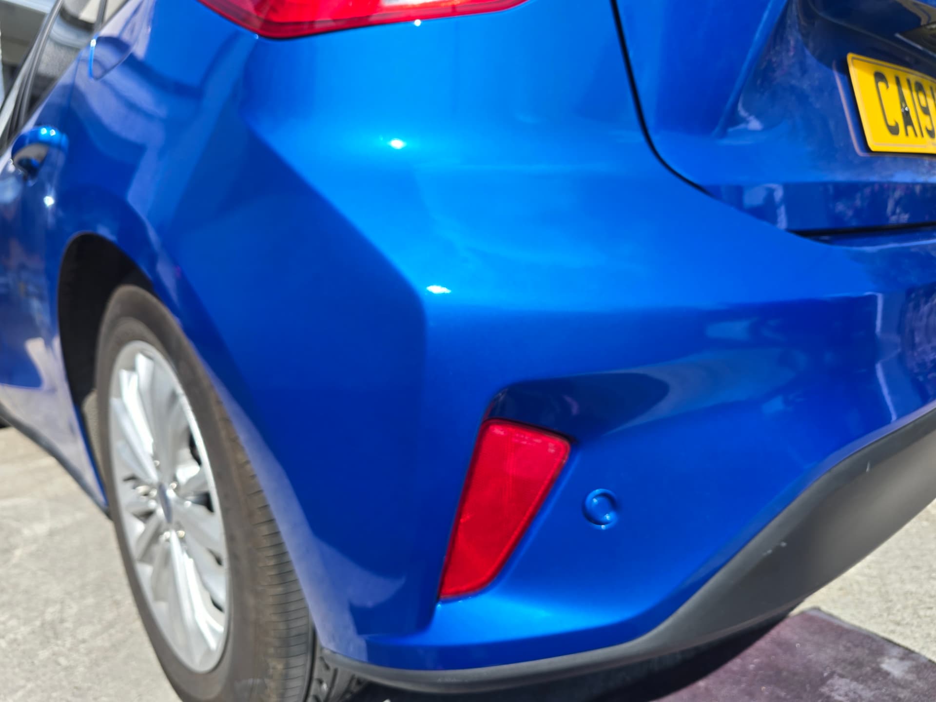 Ford Focus (blue), Bumper scuff repair, South Wales — after the SMART repair